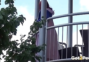 Redhead pees over say no to balcony connected with the city